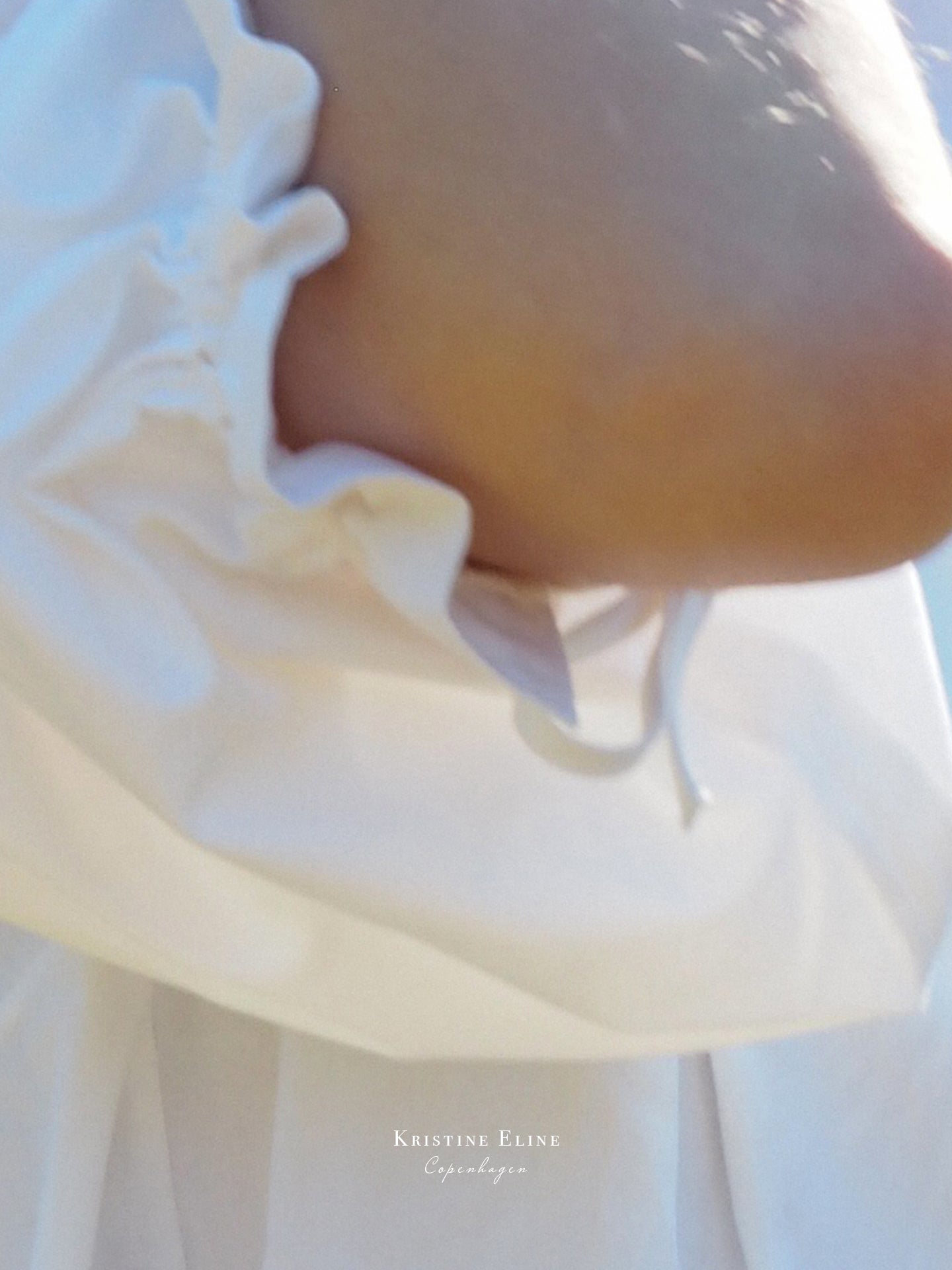 Close-up of a white garment with a blurred background