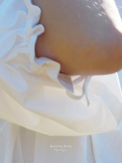 Close-up of a white garment with a blurred background